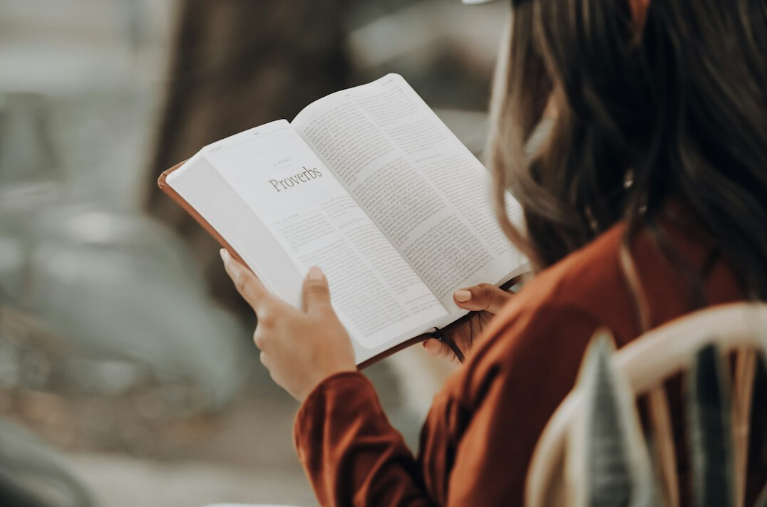 young person reading book